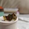The Rhea Ring – Sculpted Gold Band with Dangling Loop & Crystal
